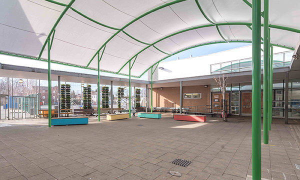 Fabric canopy covered outdoor social space for students