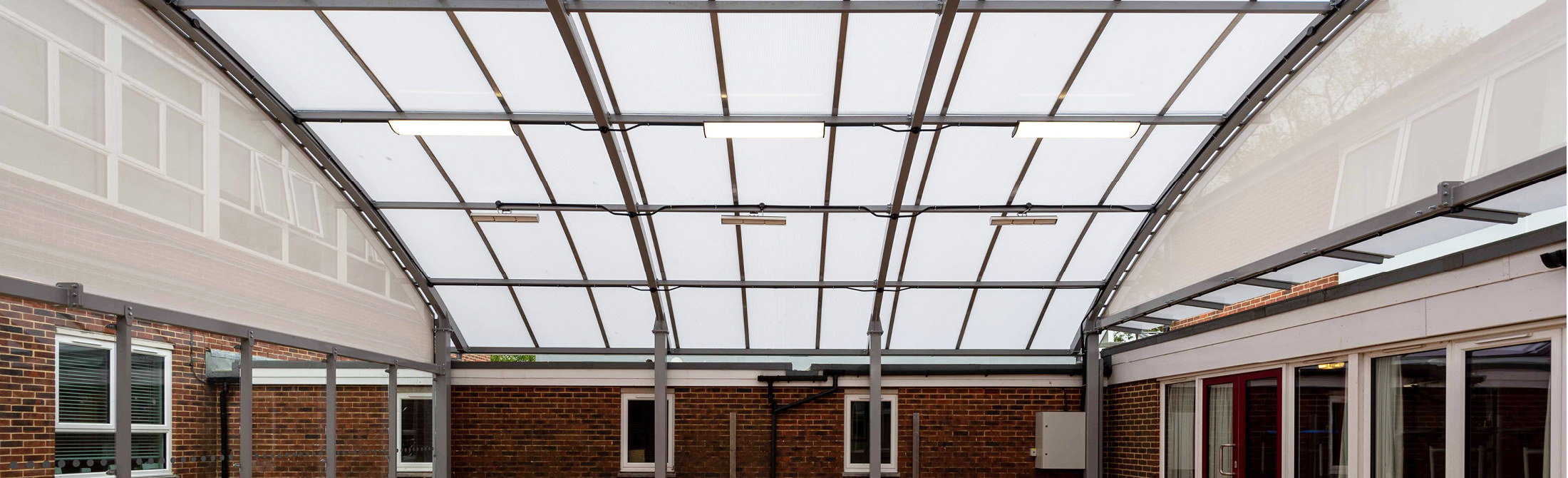 TRITON Symmetric Polycarbonate Enclosed Canopy - St Philip Howard Catholic High School