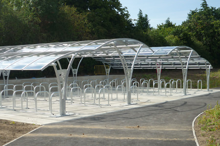Asymmetric cycle shelter with single row bike stands