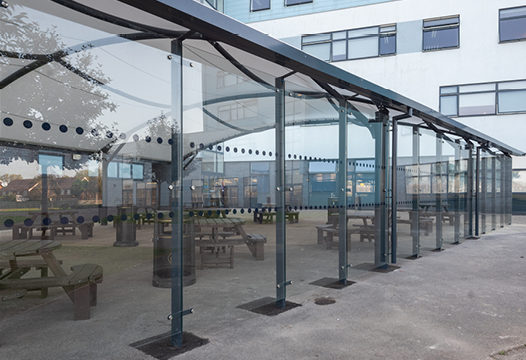 Fabric roof enclosed canopy with toughened glass cladding