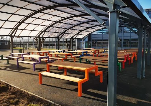 Polycarbonate roof canopy with benches and tables